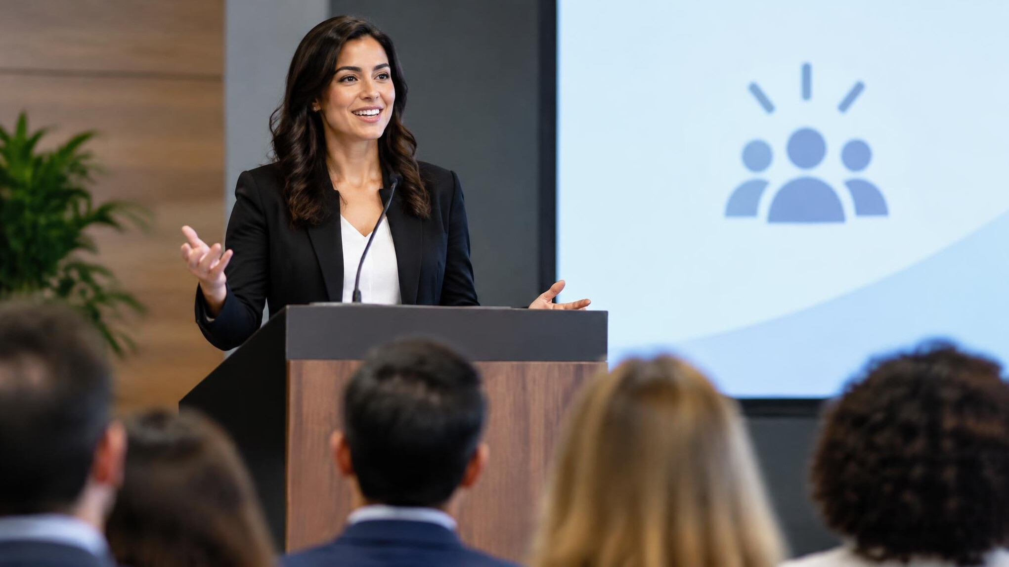 confident presenter at podium
